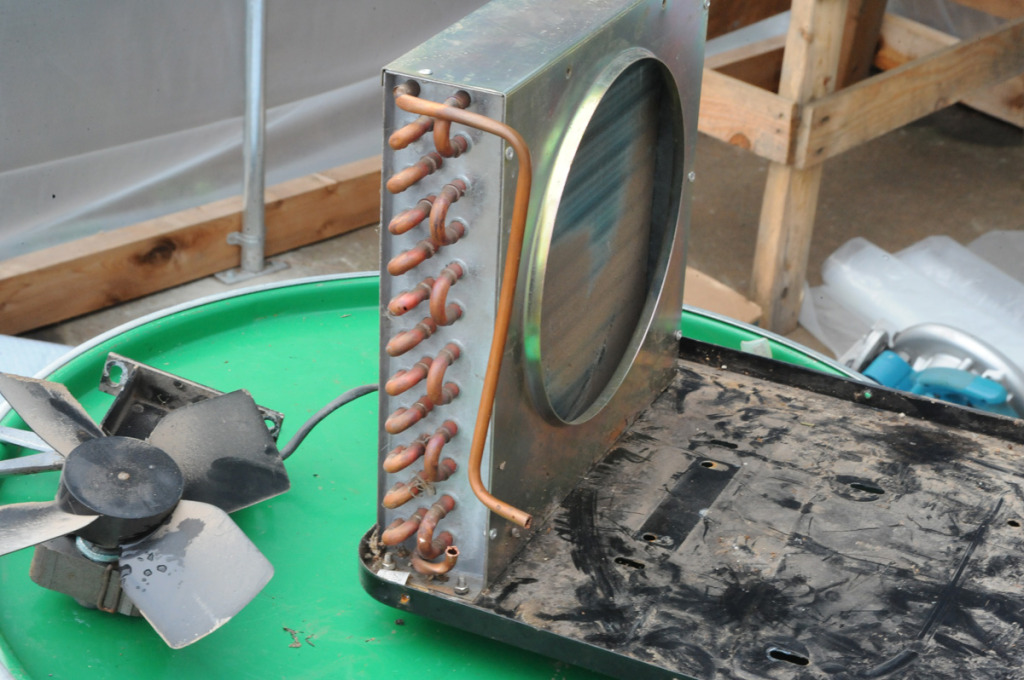 this repurposed heat exchanger can scrub away the heat captured and be distributed with fans for aerial heating